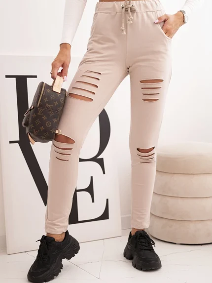 Spodnie damskie bawełniane z przetarciami i gumką w pasie beżowe