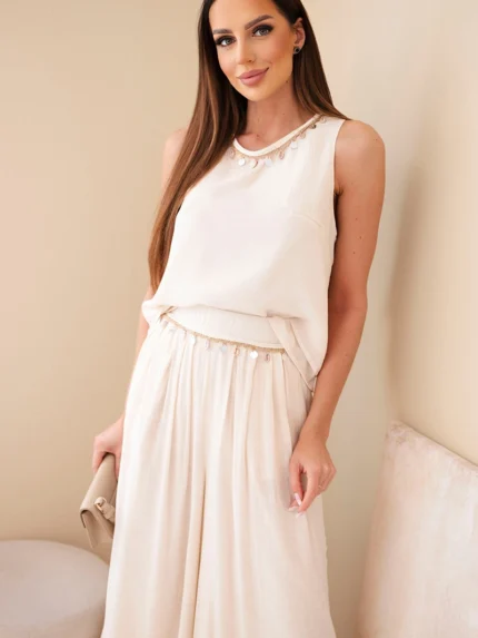 Komplet damski z wiskozą z topem bez rękawów i spodniami szeroka nogawka z ozdobnym wykończeniem beżowy